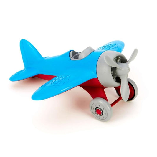Green Toys Airplane with blue wings, red landing gear, gray propeller, cockpit, and wheels. The airplane is facing to the right. Available at Green Distributors.