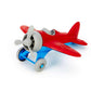 Green Toys Airplane with red wings, blue landing gear, gray propeller, cockpit, and wheels. The airplane is facing to the left. Available at Green Distributors.