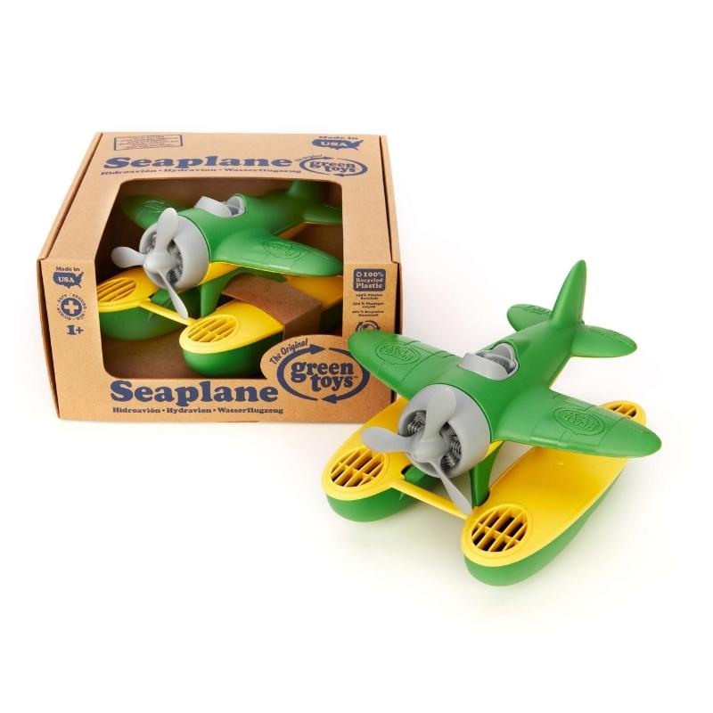 Green Toys green wing seaplane in and out of soy ink printed, cardboard box packaging. Available at Green Distributors.