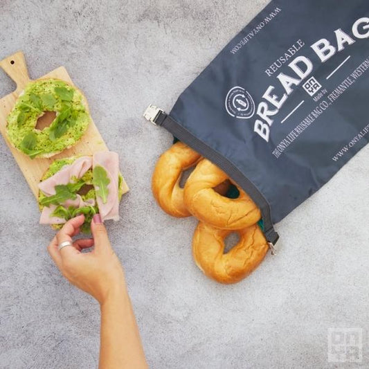 Charcoal colored Zero Waste Reusable Artisan Bread Bags by Onya holding bagels as a bagel sandwich is prepared - Green Distributors